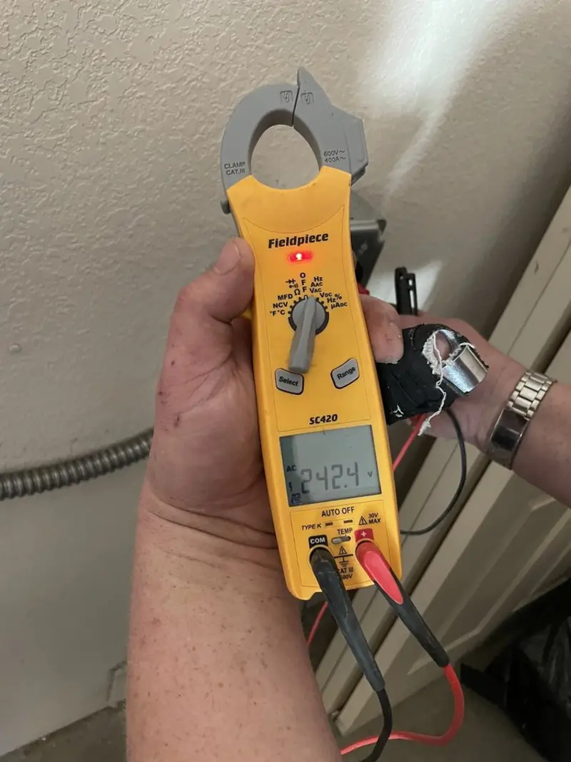 Voltage testing with clamp meter during Ceiling Fan Installation in Kinnelon